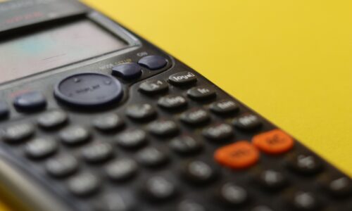 black remote control on yellow surface