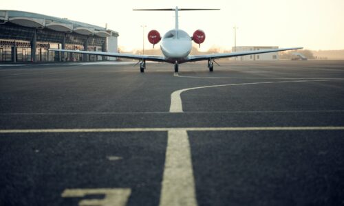 white private plane on airstrip